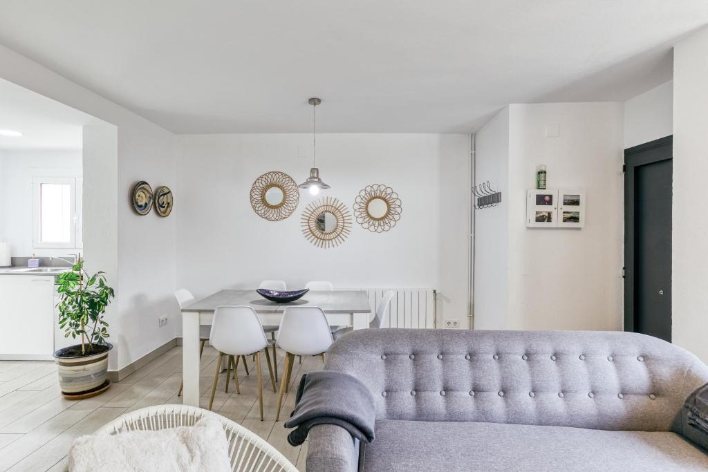 a living room with a couch and a table at Casa en Begur reformada in Begur