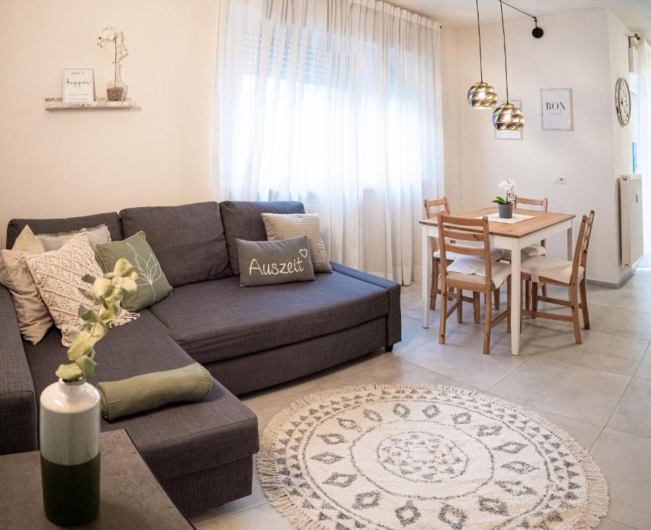 a living room with a couch and a table at Apartment Manuela in Merano