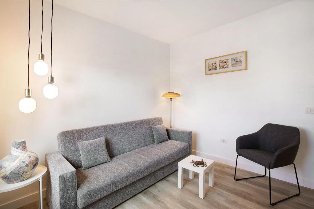 a living room with a couch and a chair at Eras Views in Las Eras