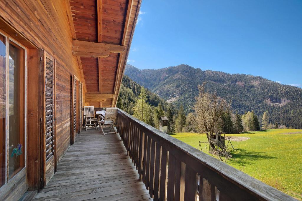 a balcony of a house with a view of a mountain at Pitschlhof Apt Lärche in Aldino