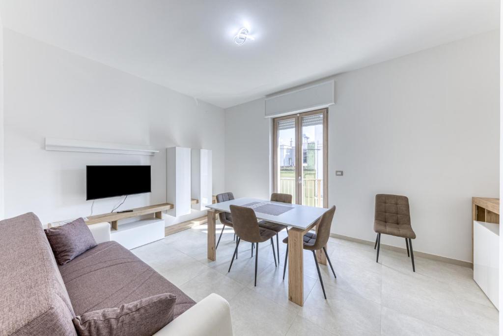 a living room with a couch and a table at Messapica Rooms in Ugento