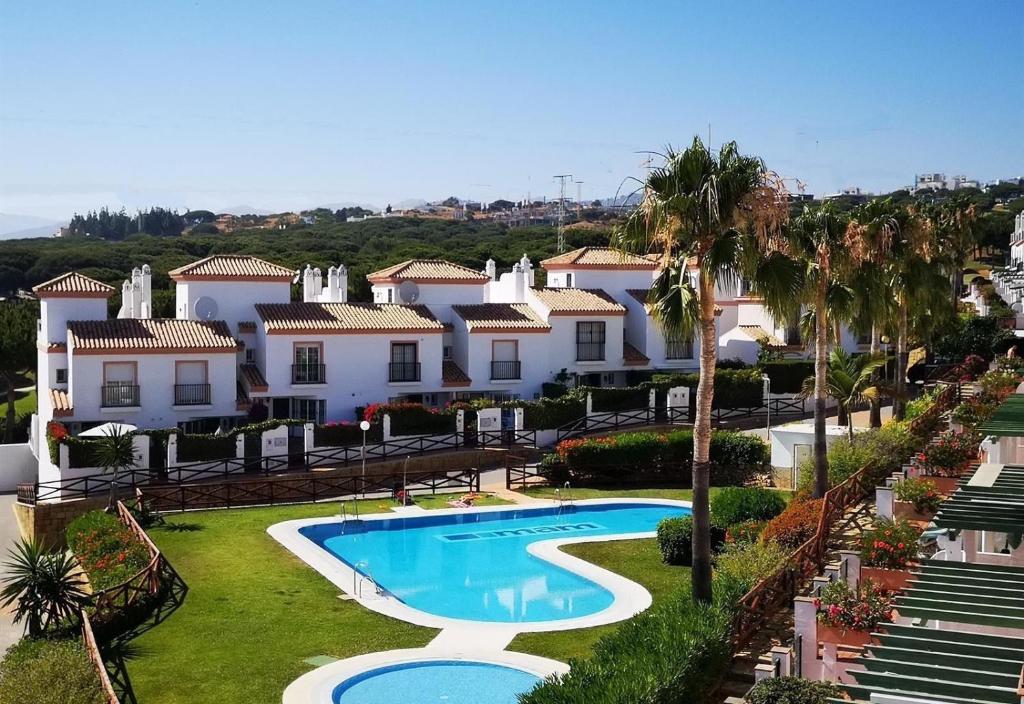an aerial view of a resort with a swimming pool at Casa Danca Cabopino in Marbella