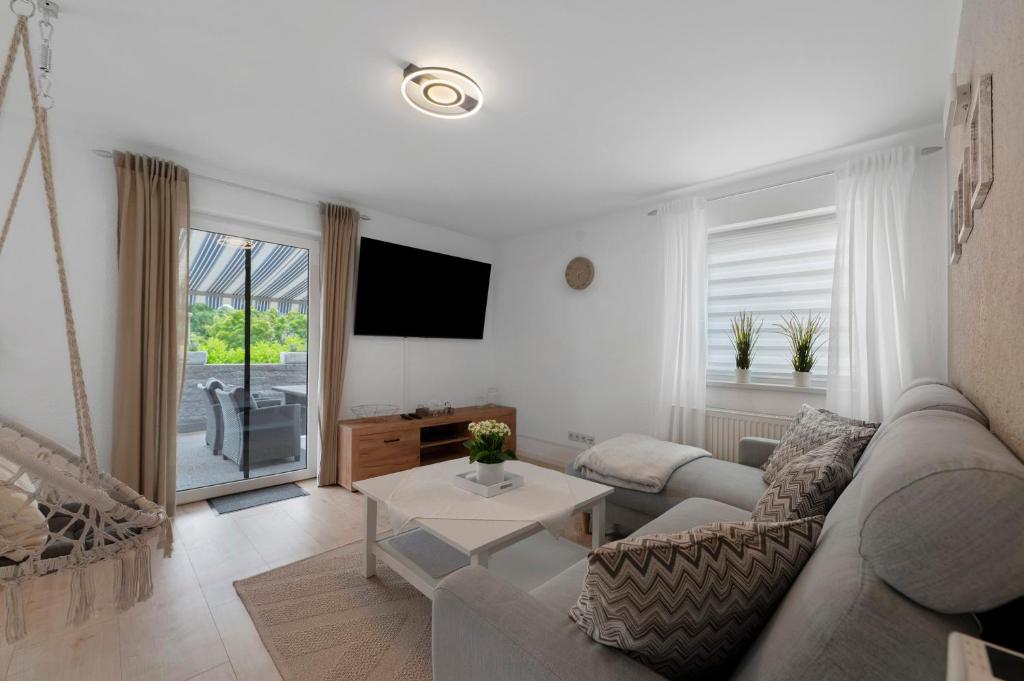 a living room with a couch and a table at Bella Casa in Sankt Wendel
