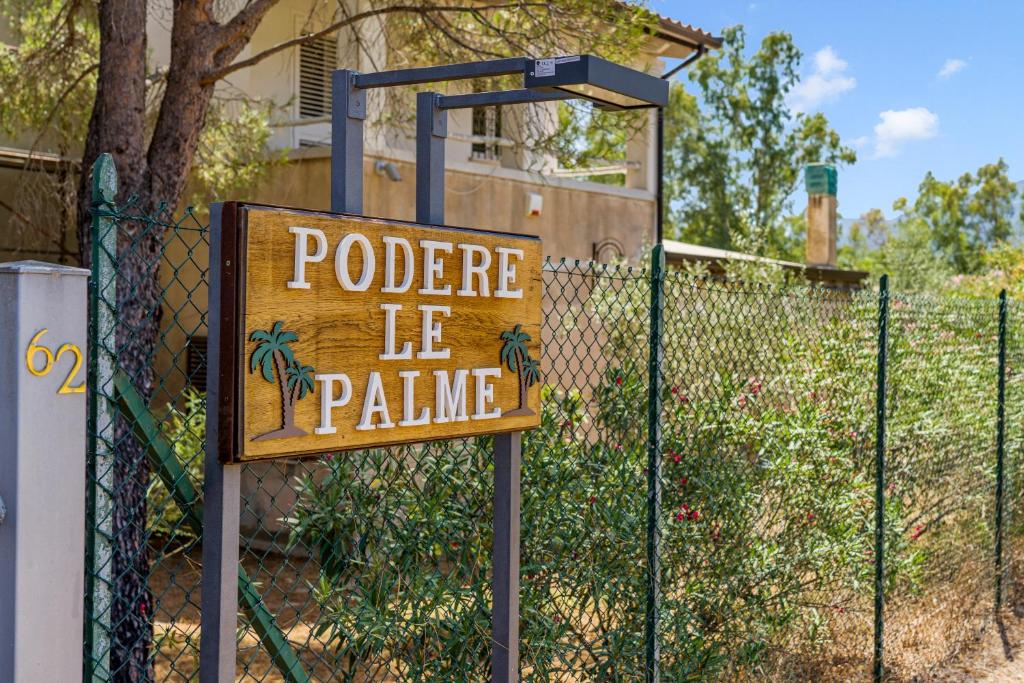 a sign on a fence that sayspolicele le pime at Podere Le Palme in Castiadas