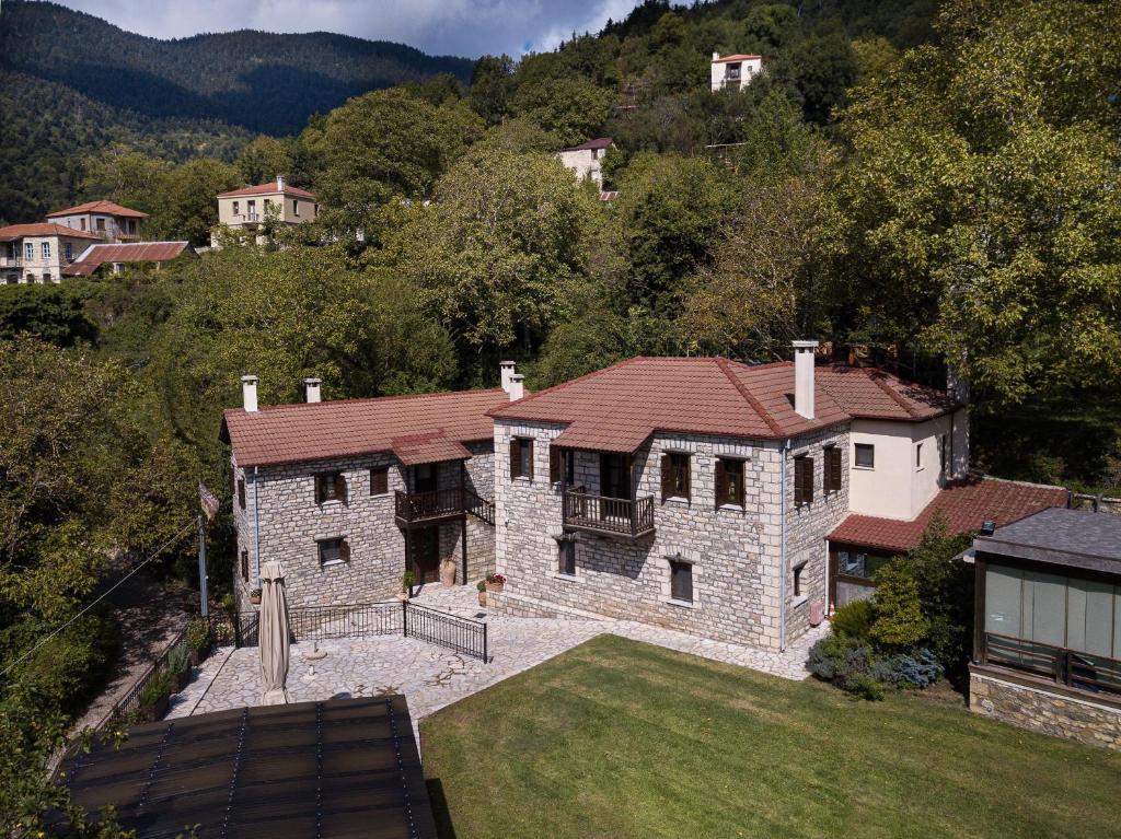 an aerial view of a large stone house at Guest House Amadryades in Karpenisi
