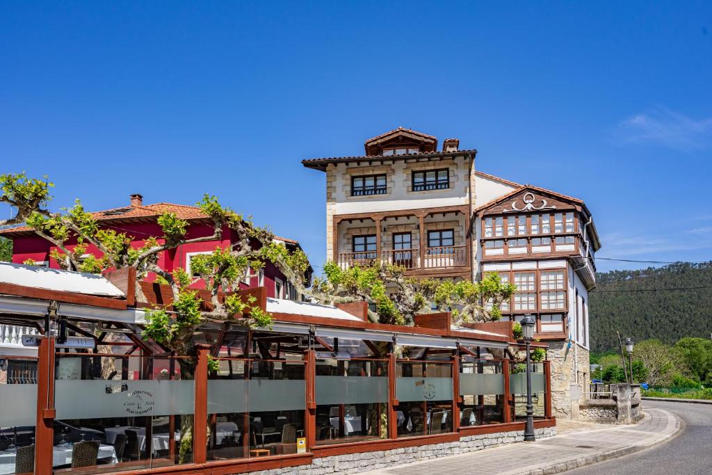 a large building with aasteryasteryasteryasteryasteryasteryasteryasteryasteryasteryastery at Apartamentos El Rincón de Bustio in Bustio