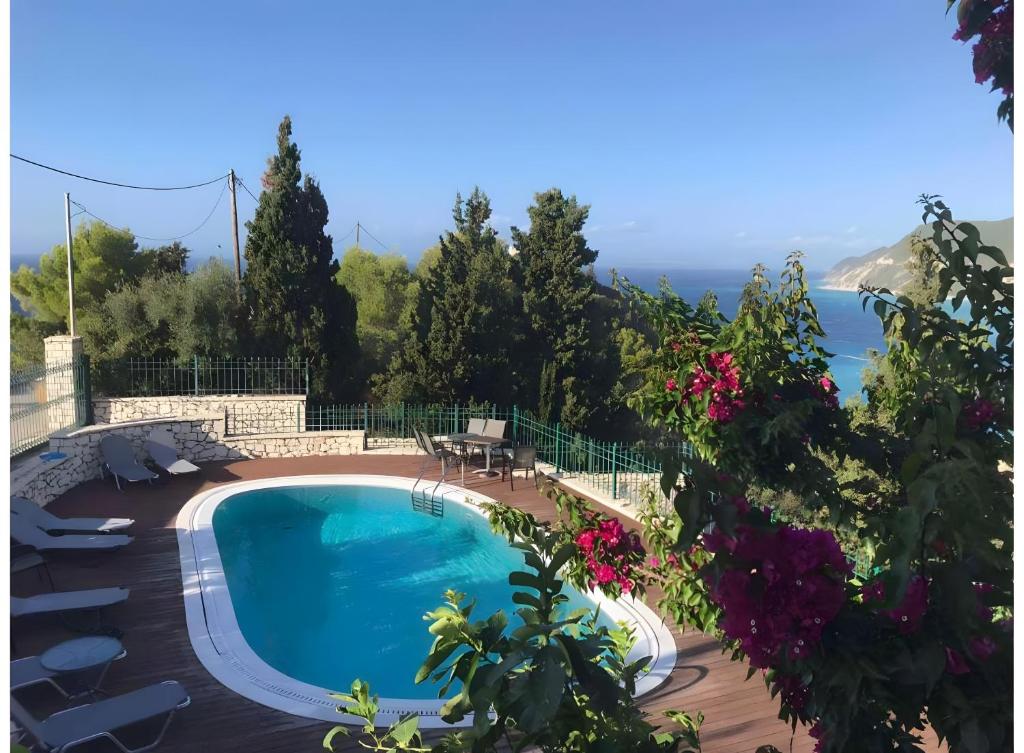 a swimming pool with a view of the ocean at Villa Milia in Agios Nikitas
