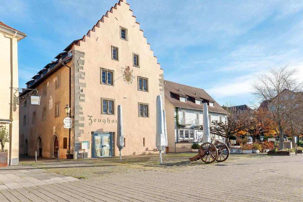 a large building with a windmill in front of it at Zeughaus Ferienwohnung in Überlingen