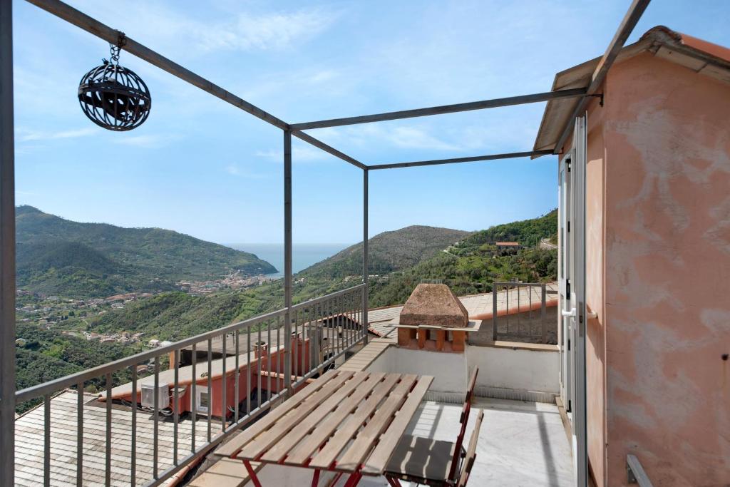 a balcony with a view of the mountains at Casa di Gina in Levanto