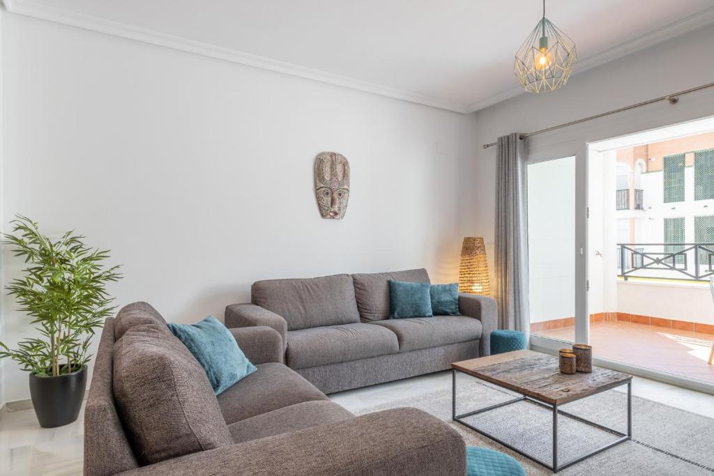 a living room with a couch and a table at Calpe Bay in Calpe