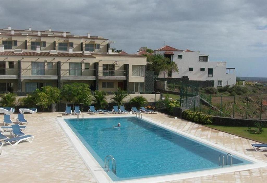 a large swimming pool in front of a building at Villa in Amarilla Golf in San Miguel de Abona