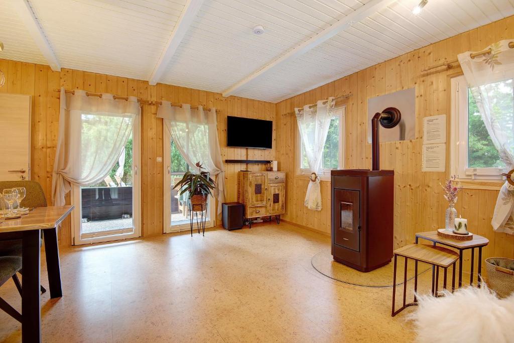 a large living room with wooden walls and a tv at Sonnenpark 44 in Roding
