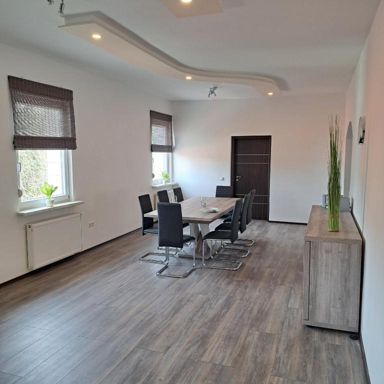 an office with a table and chairs in a room at Ferienwohnung Paulus in Albstadt