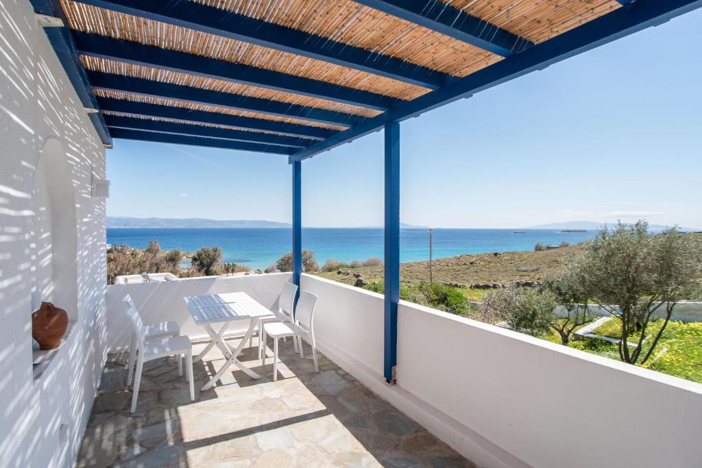 a balcony with a view of the ocean at Punda Beach Seaside Retreat in Kampos Paros