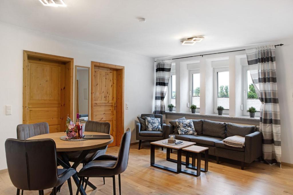 a living room with a couch and a table at Ferienwohnung Krummel in Edertal