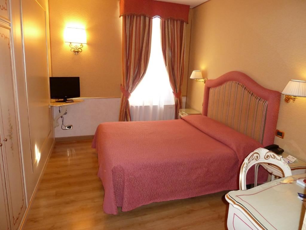 Postel nebo postele na pokoji v ubytování Casa Burchielle