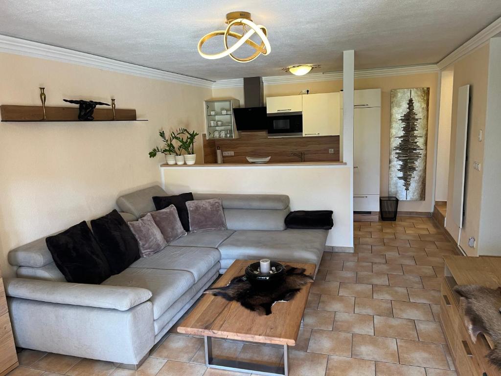 a living room with a couch and a table at Seerhaus in Mosern