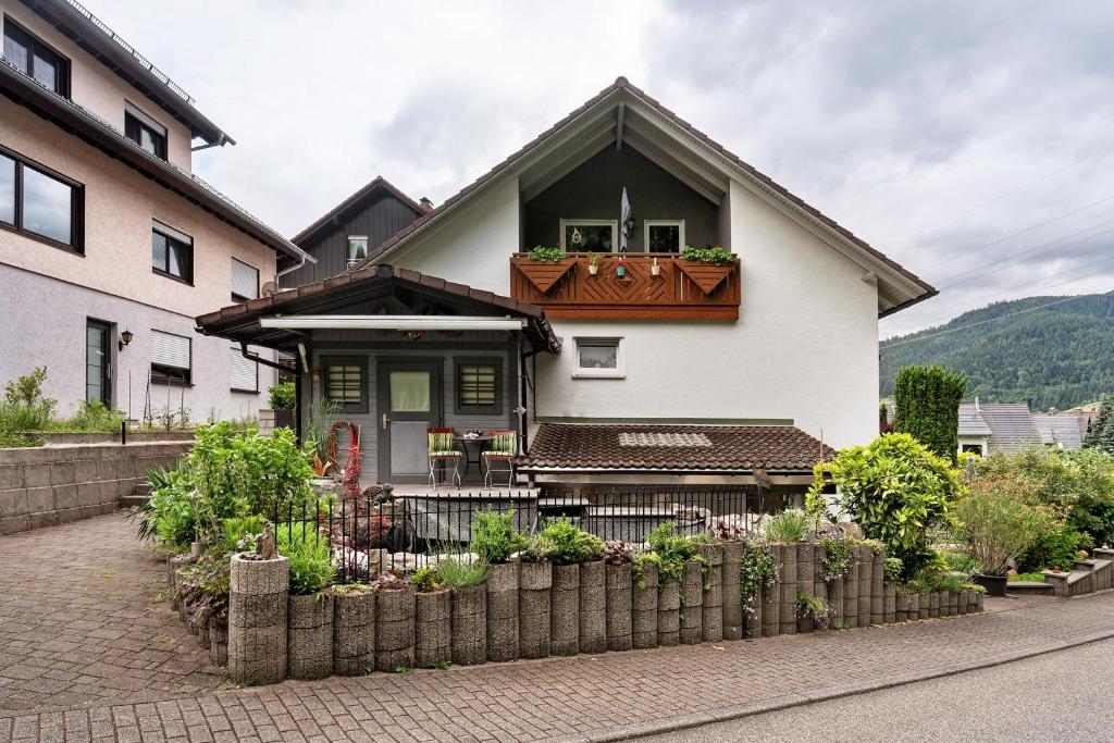 a house with a fence in front of it at Ferienwohnung Zapf in Forbach