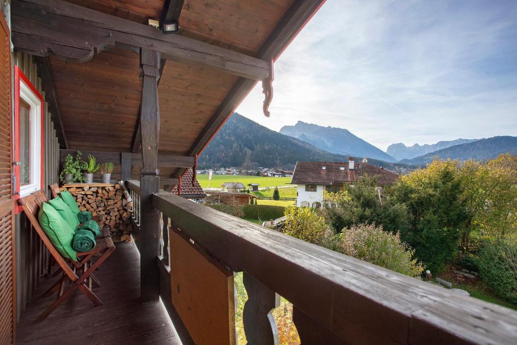 a balcony of a house with a view of the mountains at Haus Alpenveilchen - Appartement 4 in Schönau am Königssee