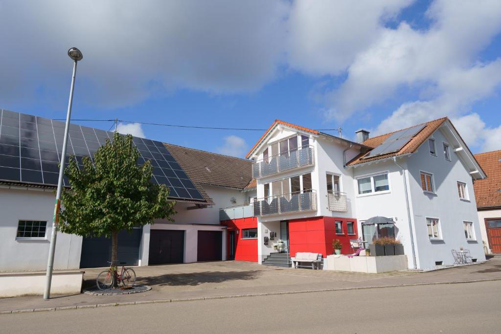 a house with solar panels on its roof at Ferienwohnung Hummel in Gammertingen