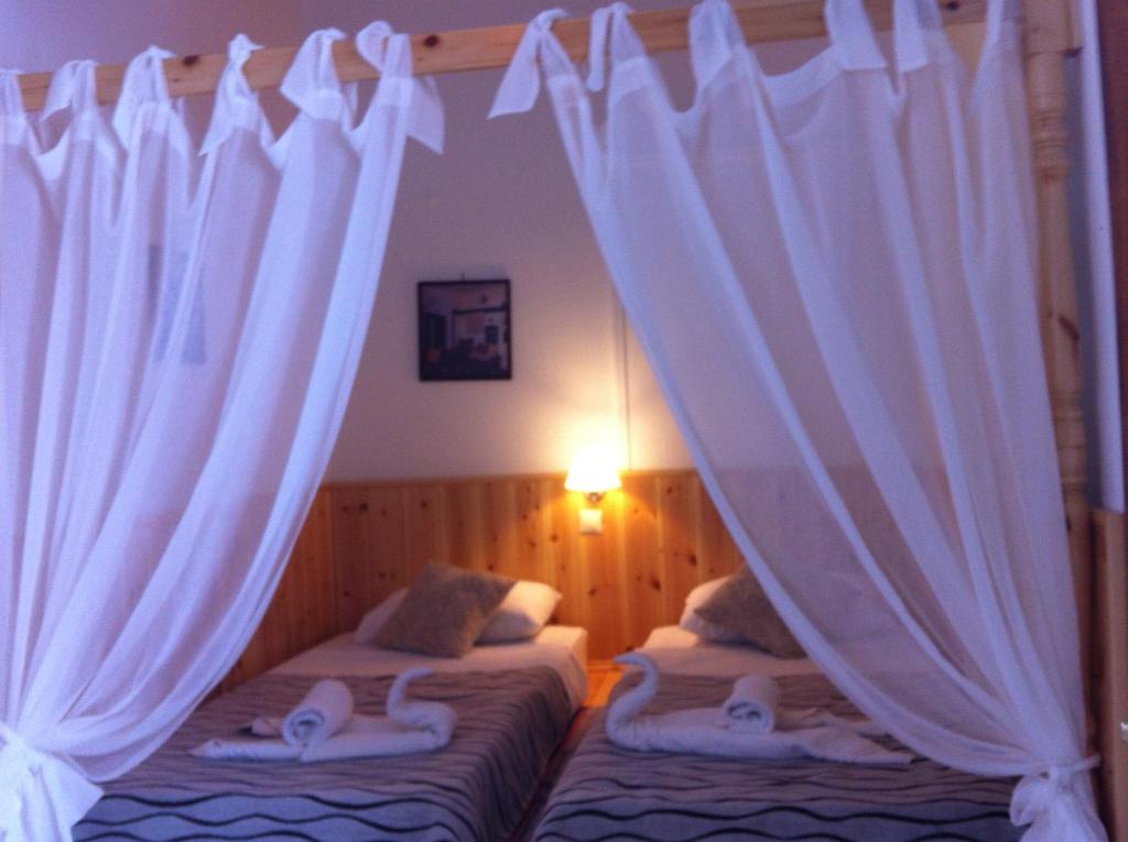 Postel nebo postele na pokoji v ubytování Villa Soultana