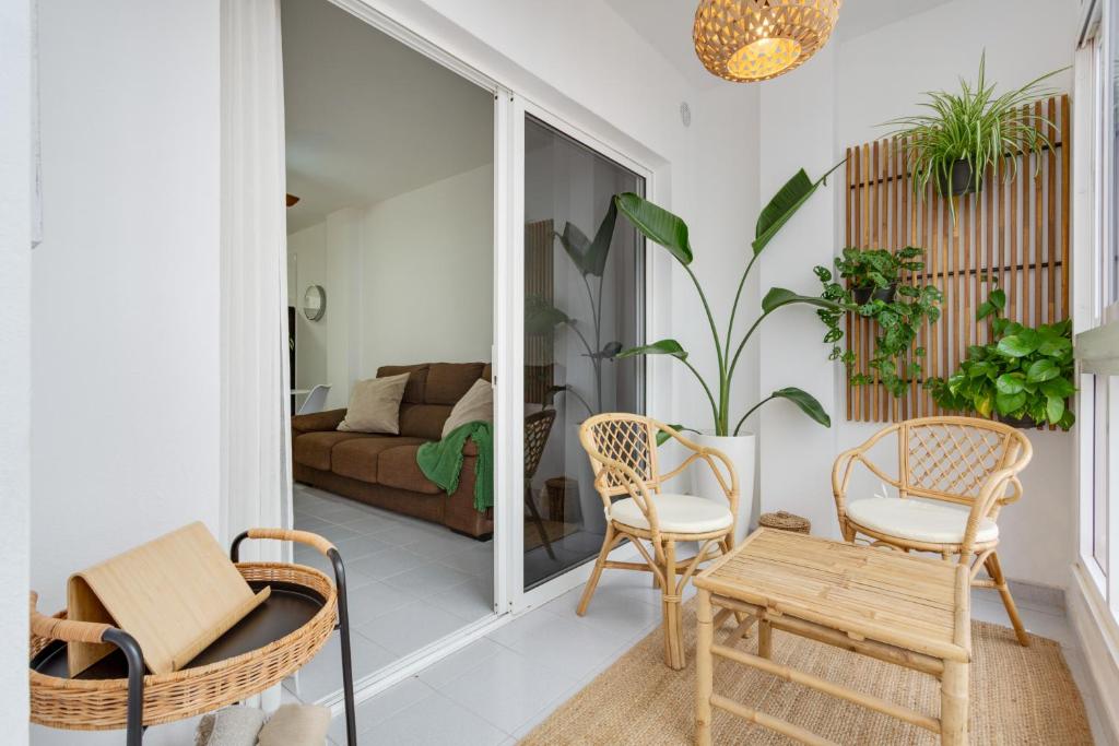 a living room with chairs and a couch at Medano House in El Médano