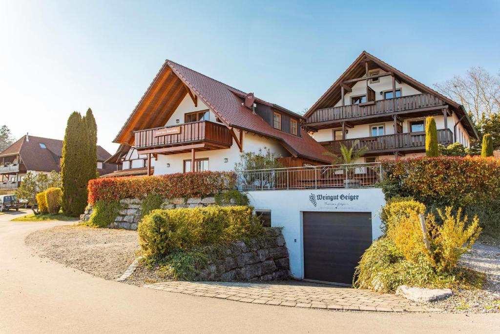a large house with a garage in front of it at Weingut Geiger in Meersburg