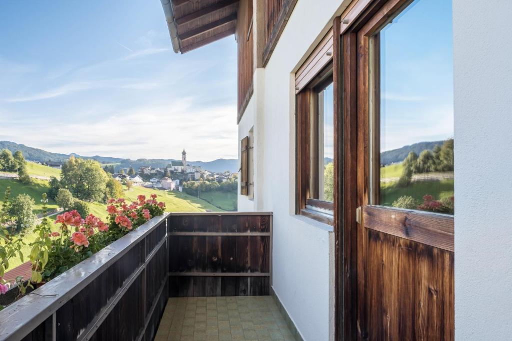 a balcony with a view of the countryside at App Schlern - Gasser in Vols am Schlern