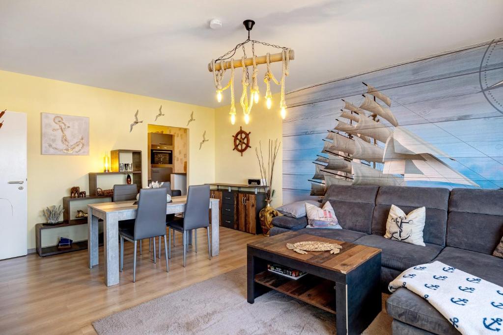 a living room with a couch and a table at Apartment Ankerplatz in Bremerhaven