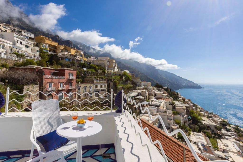 a view of the amalfi coast from the balcony of a house at Aurora Luxury Suites Seaview in Positano