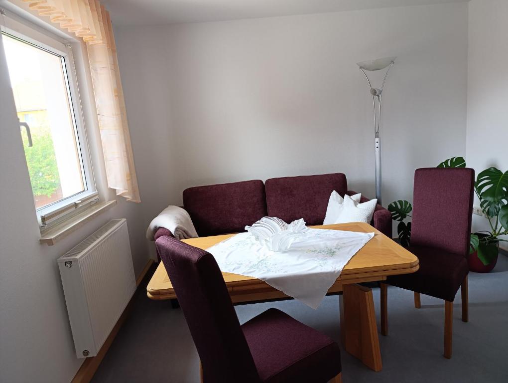 a small room with a table and a couch at Zirbelkiefer 8 in Bad Klosterlausnitz