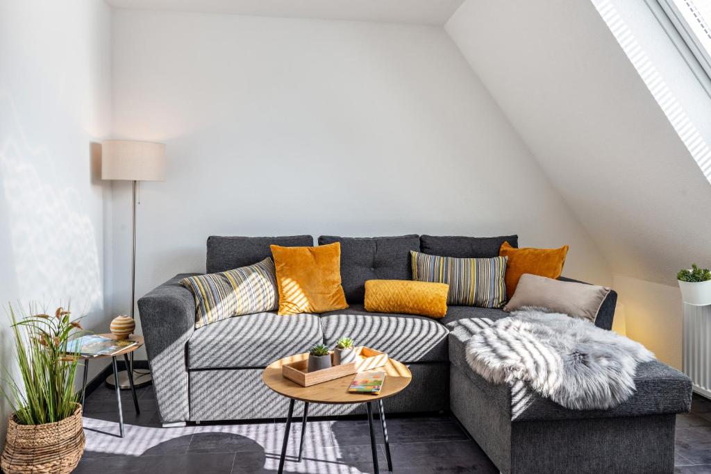a living room with a couch and a table at Fewo-Keinath in Winterlingen