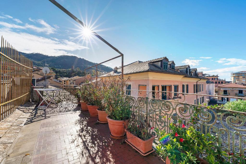 a row of potted plants on a balcony at Casa Terrazza Marino in Levanto