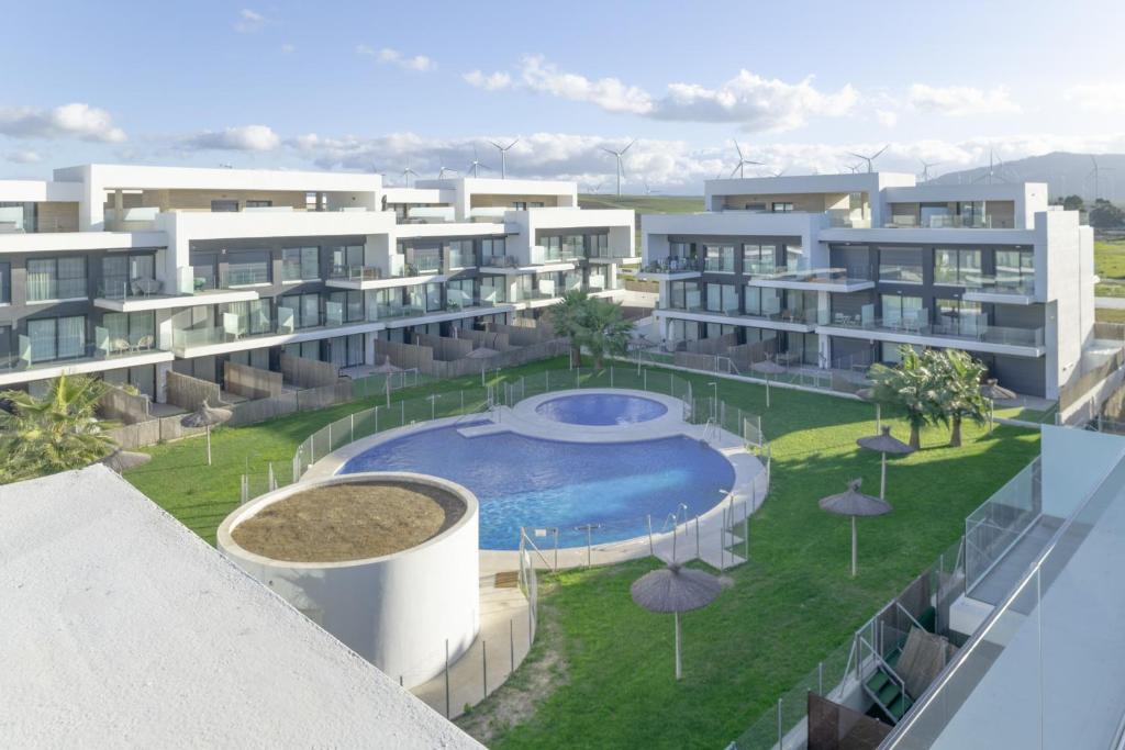an image of an apartment building with a swimming pool at Palacio de pilas 22 in Zahara de los Atunes