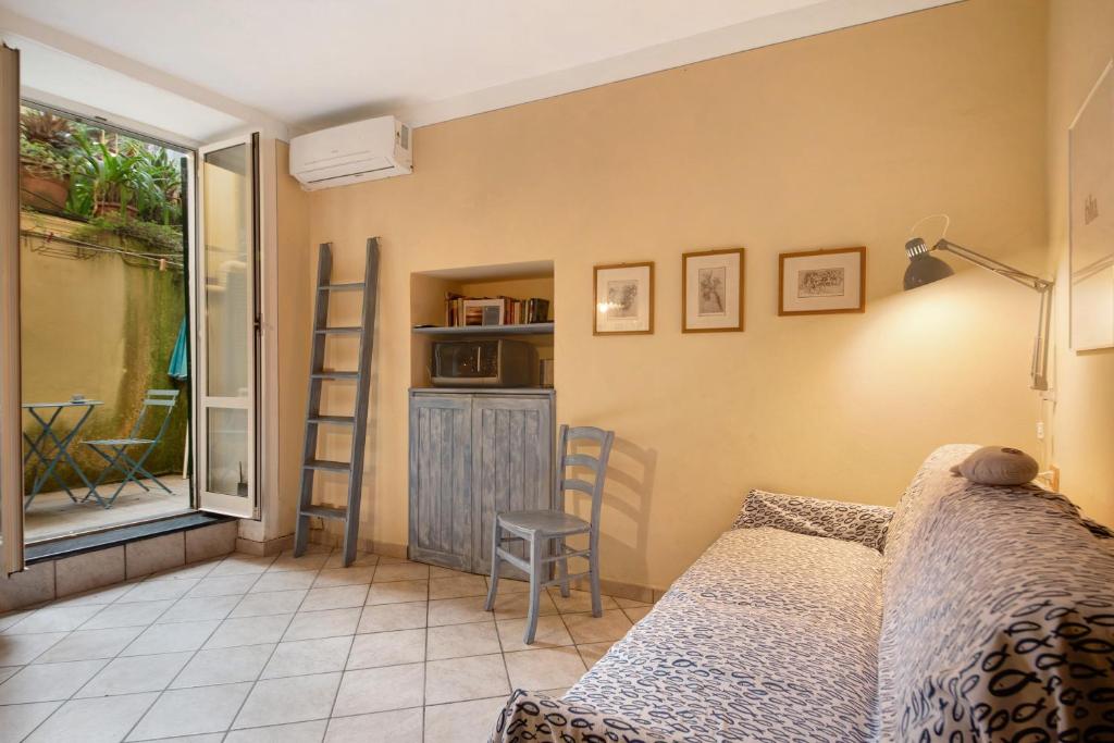 a bedroom with a bed and a window and a table at Ca Lindaria in Bonassola