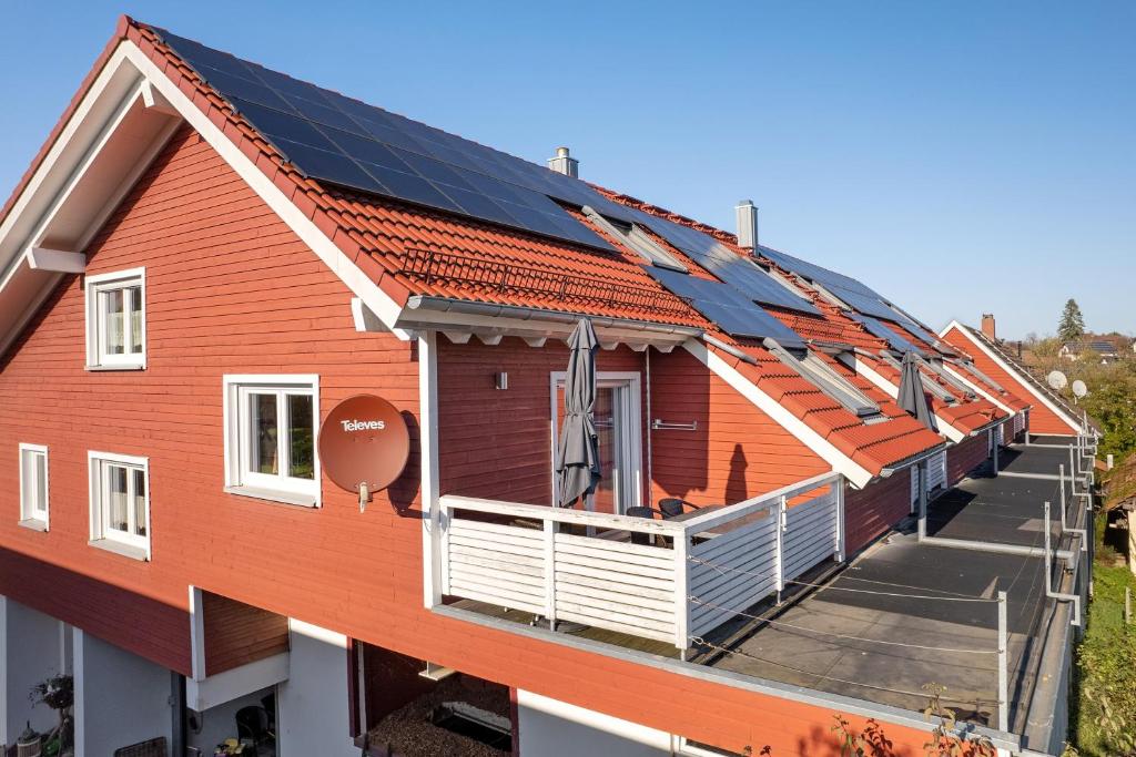 a row of houses with solar panels on their roofs at Obst- Und Ferienhof Brudy in Appenweier