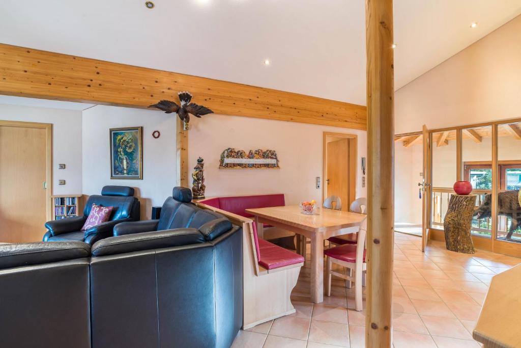 a living room with a couch and a table at Haus am Bächel in Lauf