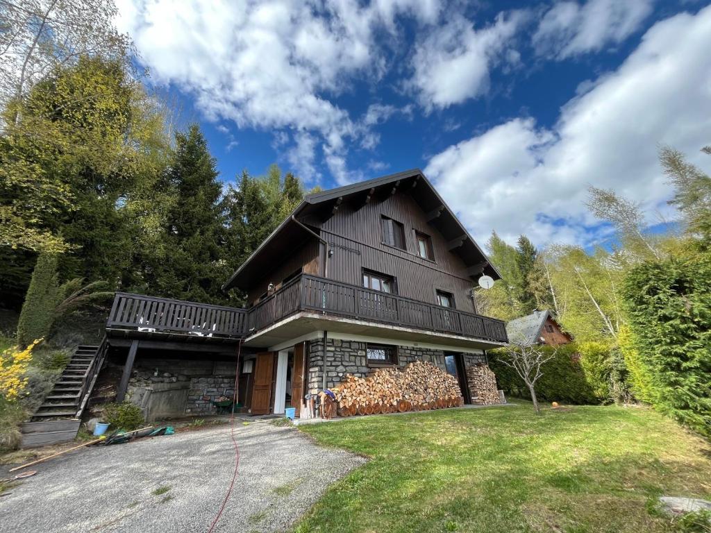 a large house with a gambrel roof at Chalet Jarrier 1400 in Jarrier