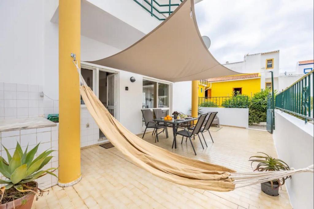 a hammock on the balcony of a house at Casa Cláudia - Centro Histórico in Lagos