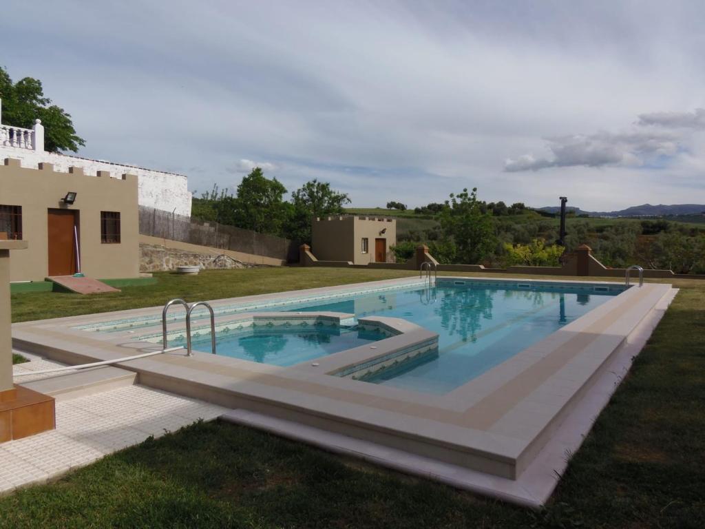 a swimming pool in the yard of a house at Casa José Romero in Arriate