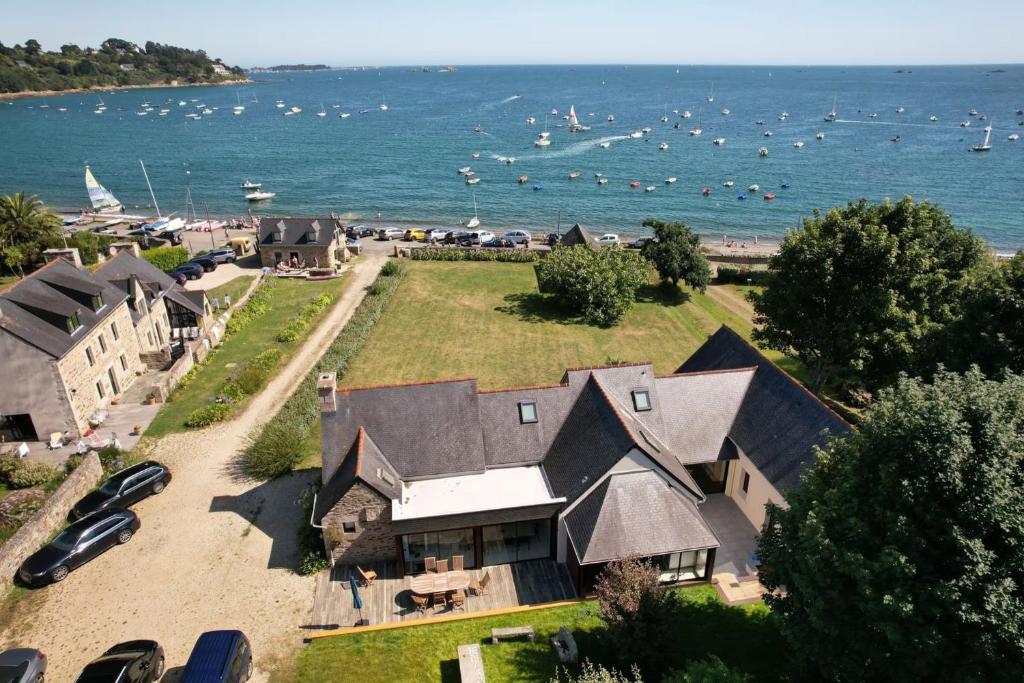 an aerial view of a large house on the beach at Maison Chevoir pieds dans l'eau in Ploubazlanec