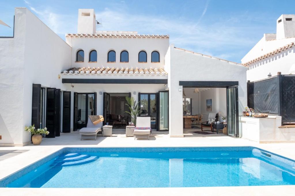 a villa with a swimming pool and a house at Casa Trebol - Private Pool Villa in San Javier