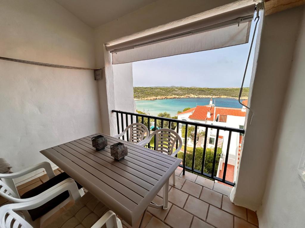 a balcony with a table and a view of the ocean at Casa Reija in Son Parc