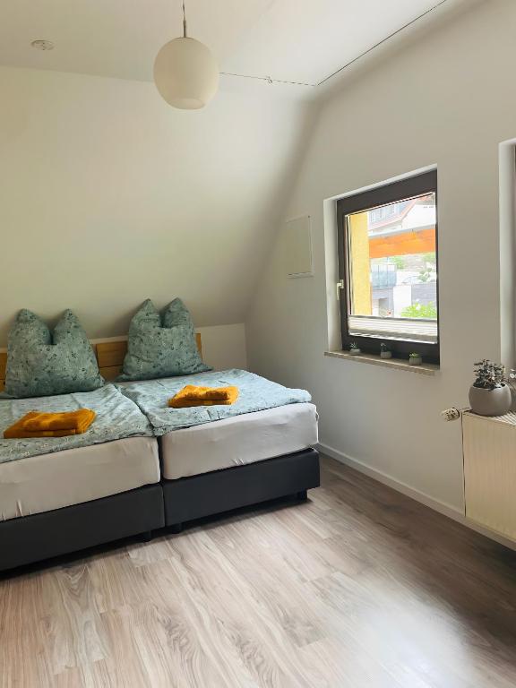 a bedroom with a bed and a tv in it at Ferienwohnung Gaßmann in Wingerode