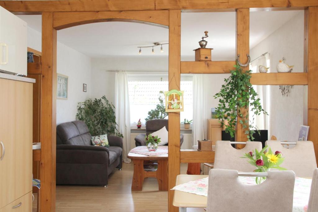 a living room with a couch and a table at Ferienwohnung Marianne in Olsberg