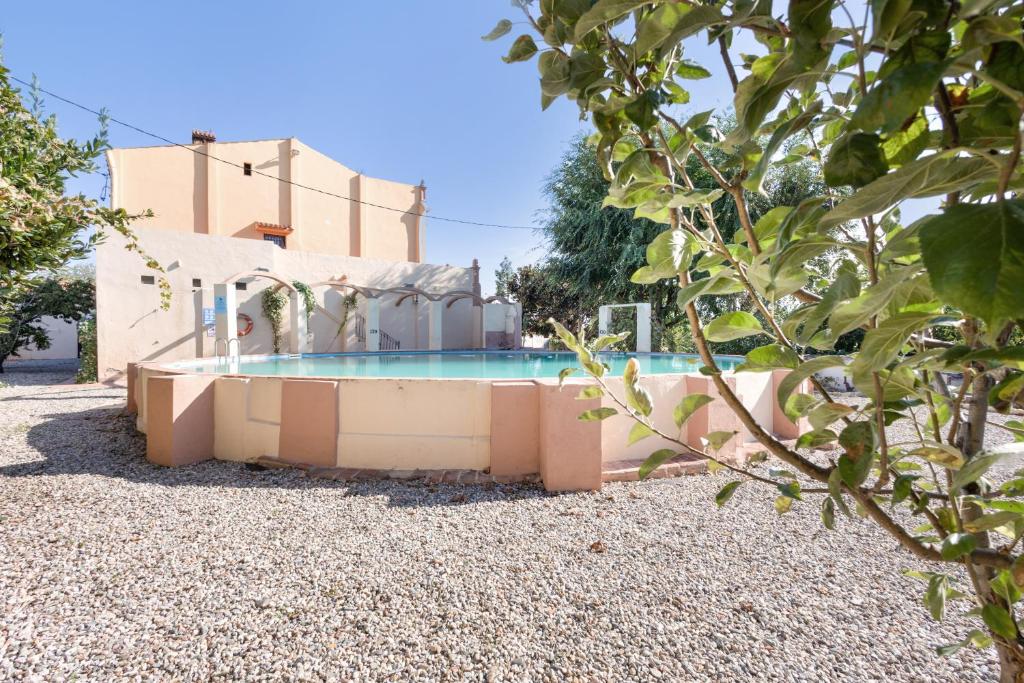 a swimming pool in front of a house at Masa La Bomba in El Masnou