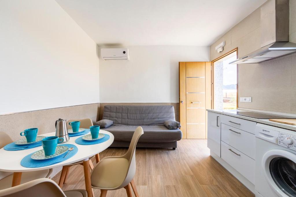 a kitchen and living room with a table and chairs at Nido in Níjar