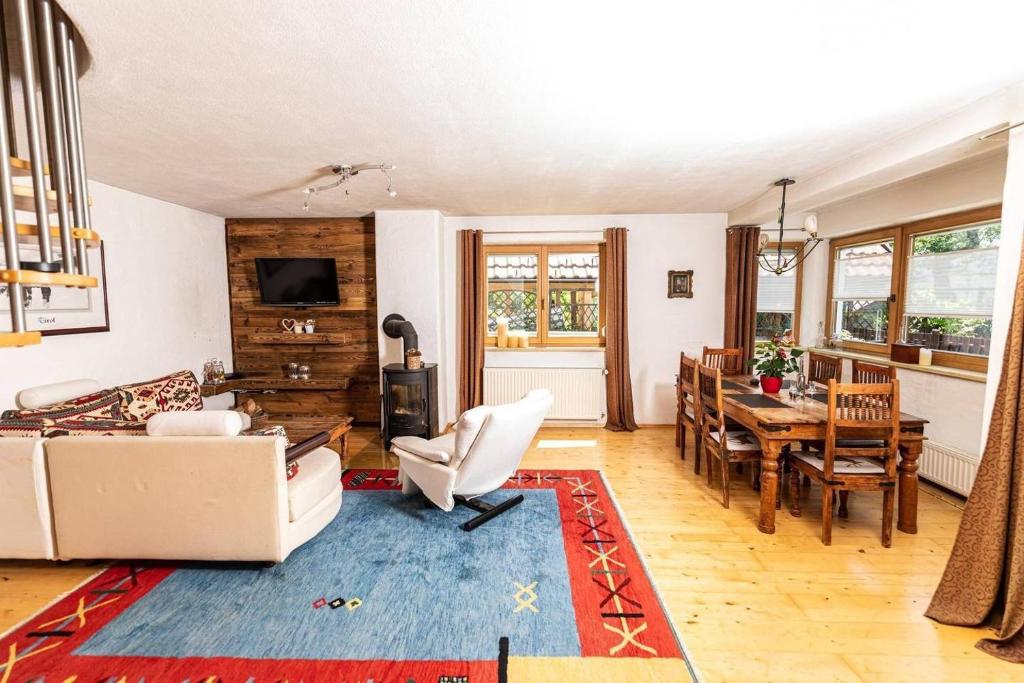 a living room with a couch and a table at Haus Evelin in Kundl