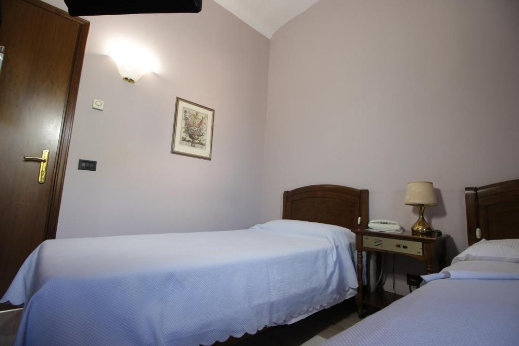Postel nebo postele na pokoji v ubytování Il Giardinetto