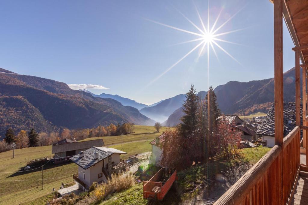 a view of the mountains from the balcony of a house at Agriturismo Soleil Levant Torgnon in Torgnon
